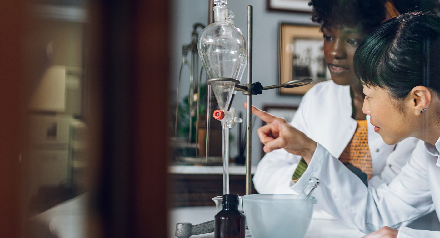 Two young female chemists in the lab